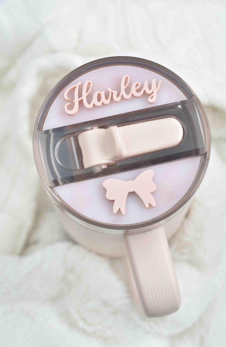 a close up of a hair dryer with two hair clips