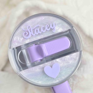 a close up of a hair brush with a heart on it