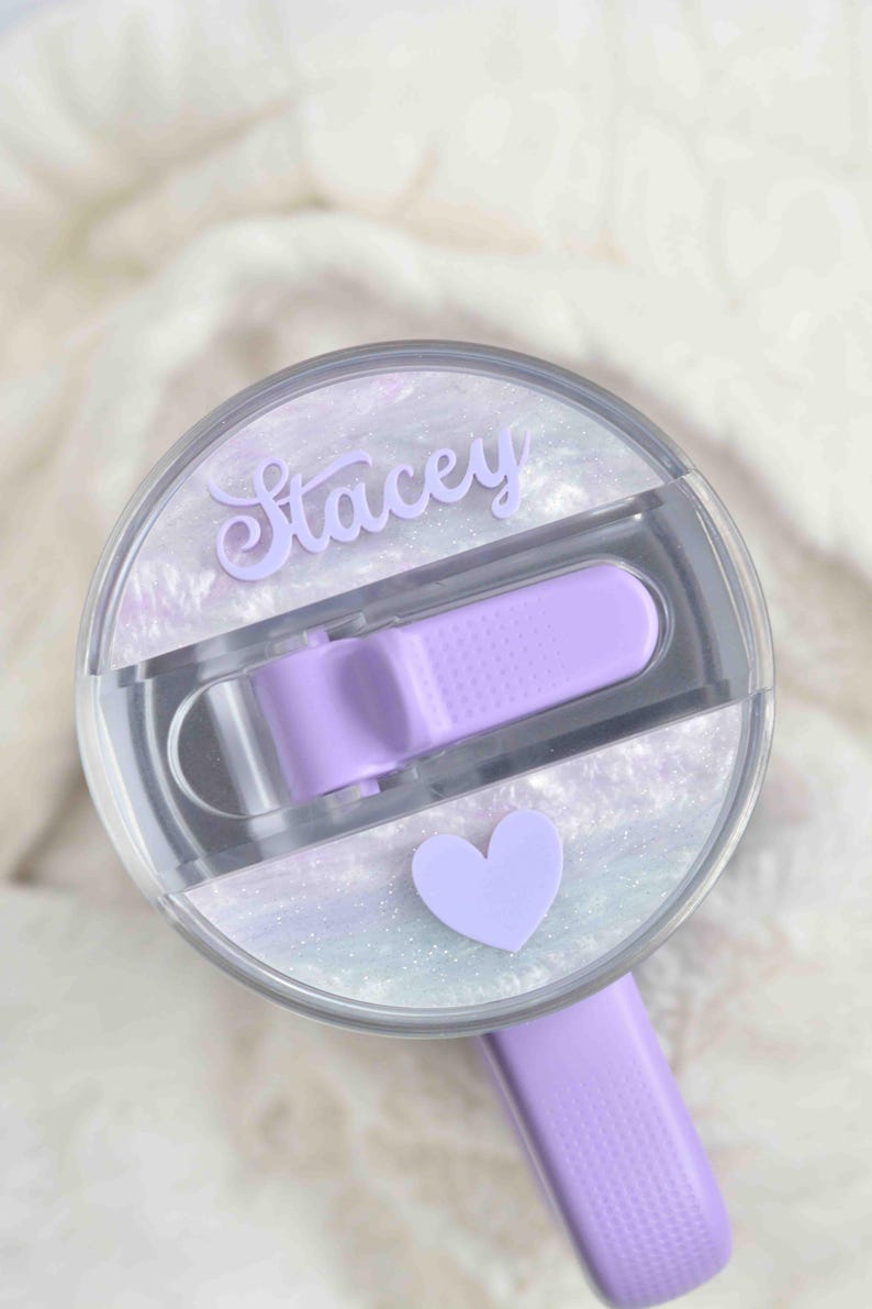 a close up of a hair brush with a heart on it