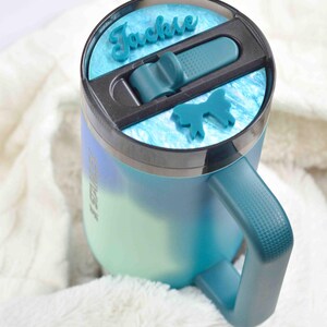 a close up of a cup on a blanket