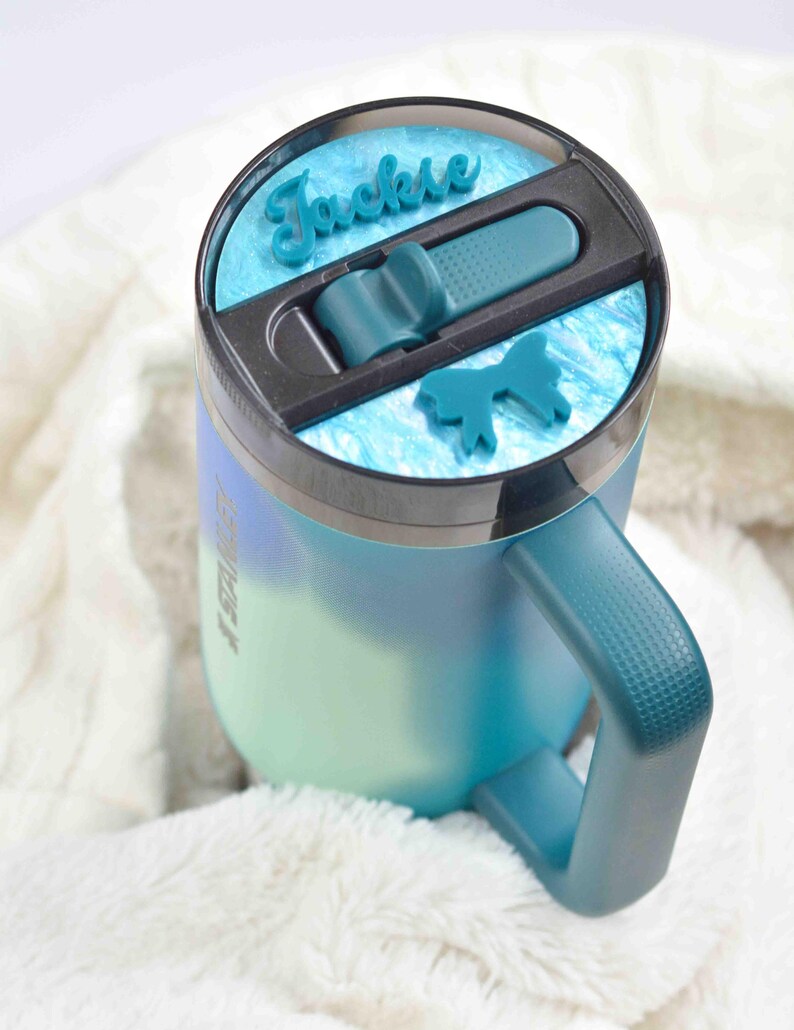 a close up of a cup on a blanket