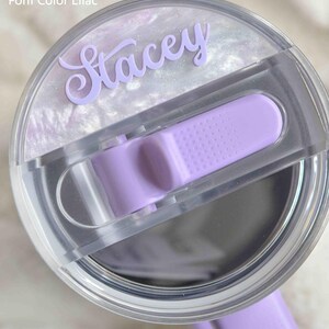 a close up of a purple watch with a plastic case