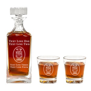 May include: A crystal decanter and two matching glasses with a nautical theme. The decanter and glasses are engraved with a US Navy anchor and the text "USN COMMAND". The decanter has the text "TEXT LINE ONE TEXT LINE TWO" and "TEXT LINE THREE TEXT LINE FOUR" engraved on it.