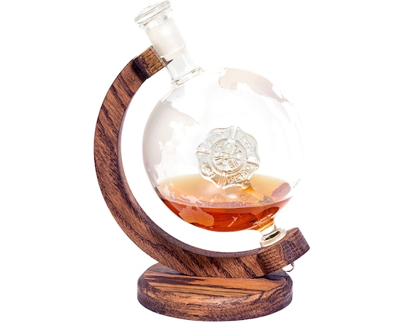 A Maltese cross-etched whiskey decanter designed specifically for firefighters — a striking, niche piece that doubles as a display-worthy tribute.