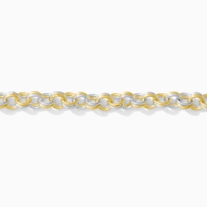 May include: A two-tone chain necklace with alternating gold and silver-colored circular links. The jewelry piece is displayed against a white background, highlighting the contrast between the metals. The chain is a simple, elegant design.