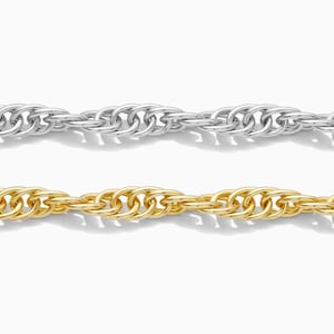 May include: Two rope chains, one silver-colored and one gold-colored, are displayed against a white background. The chains are made of twisted metal links, creating a textured surface. The chains are likely jewelry, such as necklaces or bracelets.