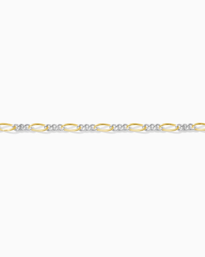 May include: A gold and silver chain necklace. The necklace features a repeating pattern of oval gold links alternating with silver links. The chain is displayed against a white background.