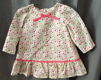 Girl's size 12 mo. long sleeve dress. Polka dot fabric with ribbon trim.