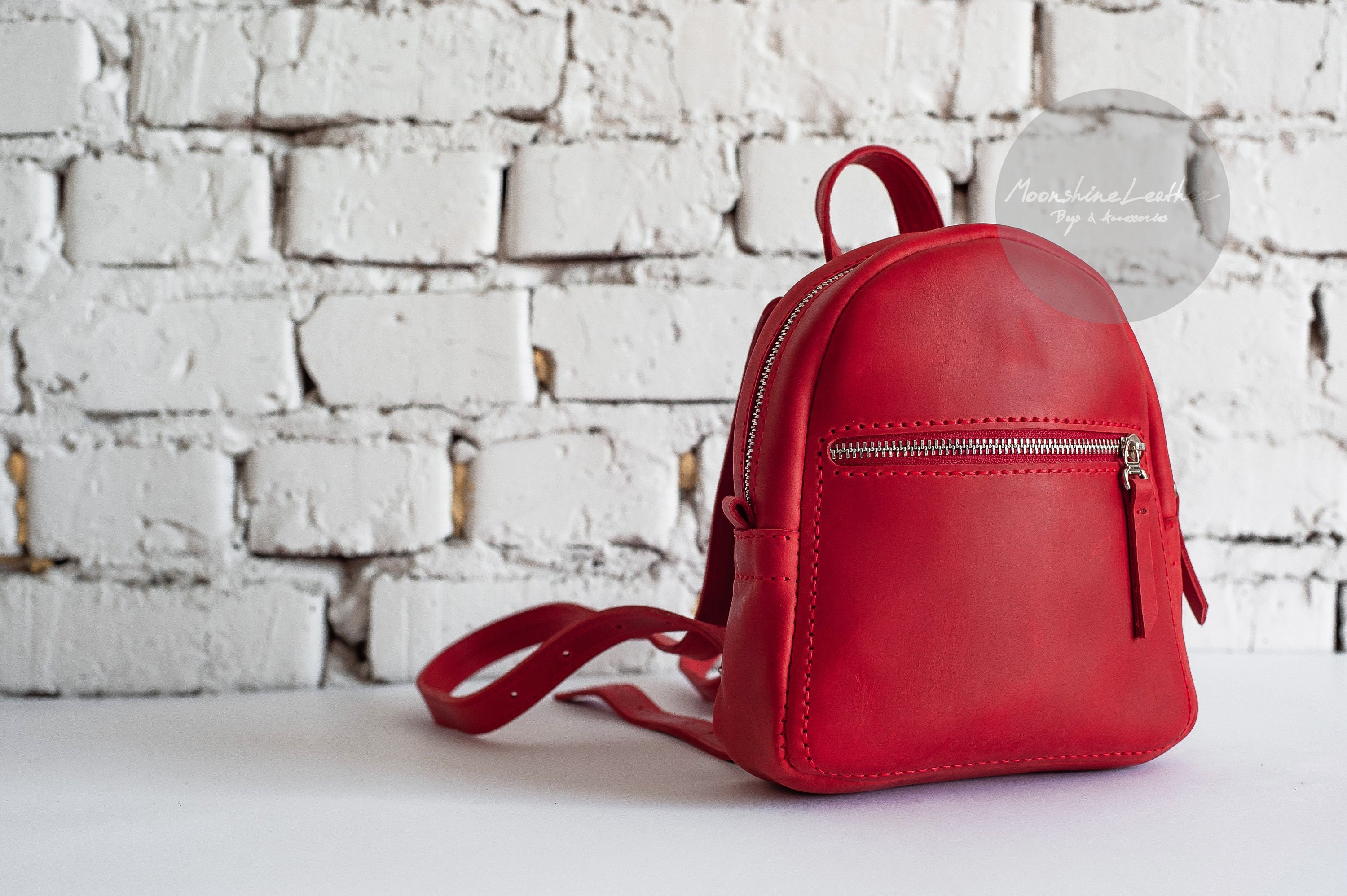 small red backpack purse