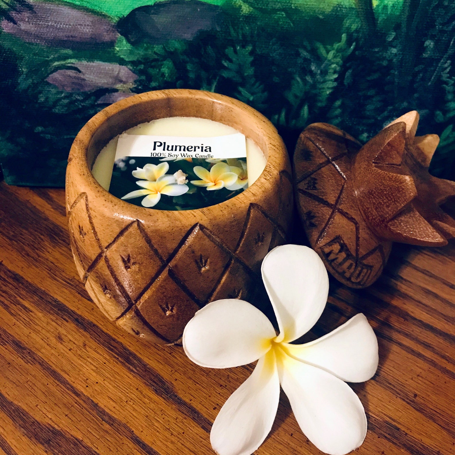 Plumeria-scented candle in a pineapple-shaped wooden bowl is one of the best Hawaiian souvenirs
