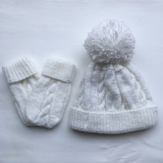 white baby hat and mittens