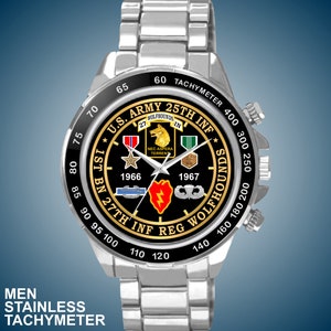 May include: Stainless steel watch with a black face featuring the U.S. Army 25th Infantry Division Wolfhounds emblem. The watch has a tachymeter bezel and the text "MEN STAINLESS TACHYMETER".