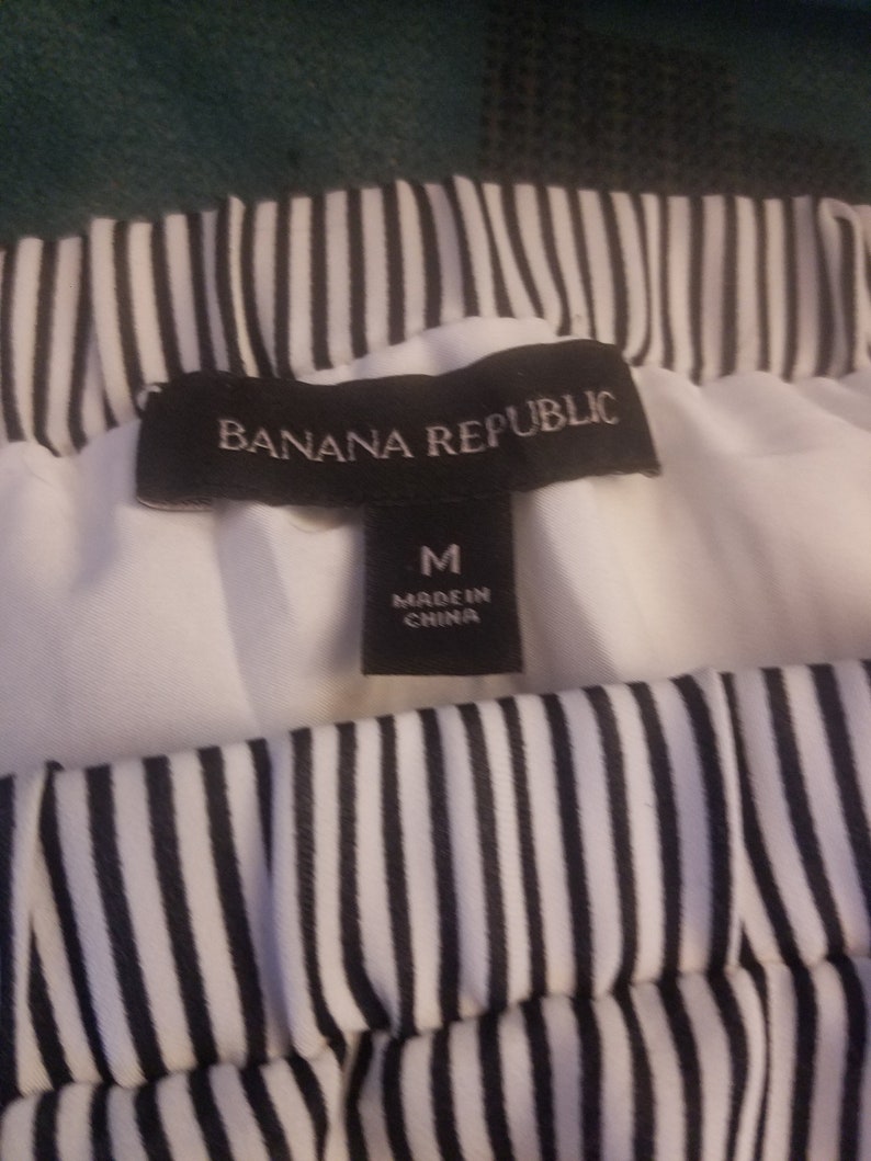 Upcycled Banana Republic short skirt size Medium with stripes and 13-point Bolt.