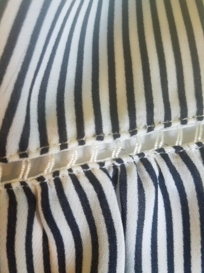 Upcycled Banana Republic short skirt size Medium with stripes and 13-point Bolt.