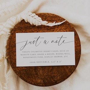 May include: A wooden coaster with a white card that reads "just a note" in cursive. The card is 3.5" x 2" and includes text about creating insert cards. A white feather and dried plant accents the scene.
