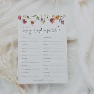 May include: A printable baby word scramble game with a floral border. The game features a list of 14 baby-related words that are scrambled. Players must unscramble the words to complete the game.