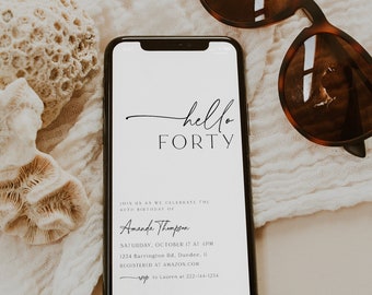 May include: A smartphone displaying a birthday invitation for Amanda Thompson's 40th birthday party. The invitation is white with black text and includes the date, time, location, and RSVP information. The phone is lying on a white fabric surface with a pair of brown sunglasses and a piece of coral.