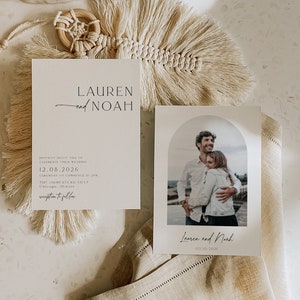 May include: Two wedding invitations with a minimalist design. The first invitation is white with black text and says "Lauren and Noah" and includes the date "12.08.2026". The second invitation is white with a photo of a couple in front of a beach and says "Lauren and Noah" and includes the date "03.10.2021".