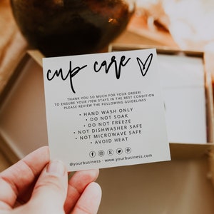 May include: A white card with black text that reads "cup care" with a heart symbol. The card provides care instructions for a cup, including hand washing only, not soaking, not freezing, not dishwasher safe, not microwave safe, and avoiding heat. The card also includes social media icons and the text "@yourbusiness - www.yourbusiness.com".