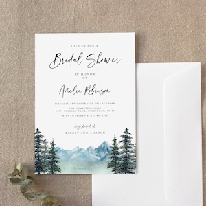 May include: A white invitation card with a watercolor illustration of a mountain range and pine trees. The text on the card reads "Join us for a Bridal Shower in honor of Arhelia Robinson. Saturday, September 21st, 2023 at 2:00PM The Homestead Ville 35771 Chicago Trail, Chicago, IL 60618 RSVP to Lauren at 123.456.7890 Registered at Target and Amazon"