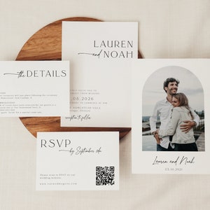May include: Wedding invitation suite with a white background and black text. The invitation features a photo of a couple in a romantic embrace. The text reads "Lauren and Noah" and "03.10.2021".