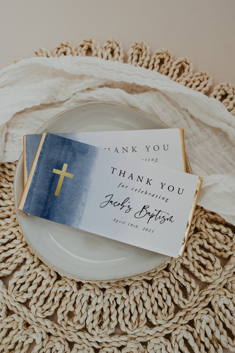 May include: Two white thank you cards with blue watercolor backgrounds and gold crosses. The text on the cards reads "Thank you for celebrating Jacob's Baptism April 18th, 2021".