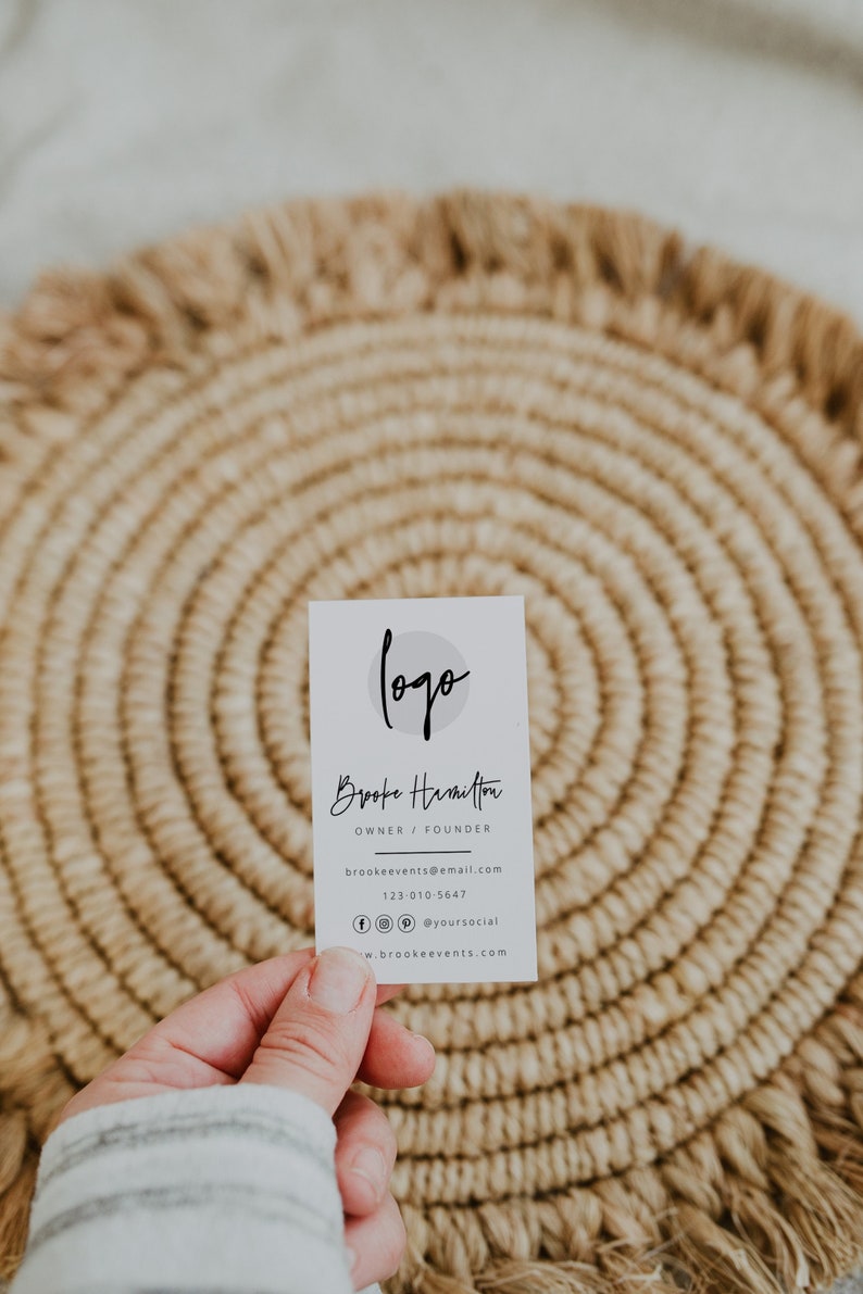 May include: White business card with a logo and the text "logo" in a circle. The text "Brooke Hamilton" is below the logo, followed by "Owner / Founder". The text "brookeevents@email.com" is below that, followed by "123-010-5647". The text "@yoursocial" is below that, followed by "www.brookeevents.com".