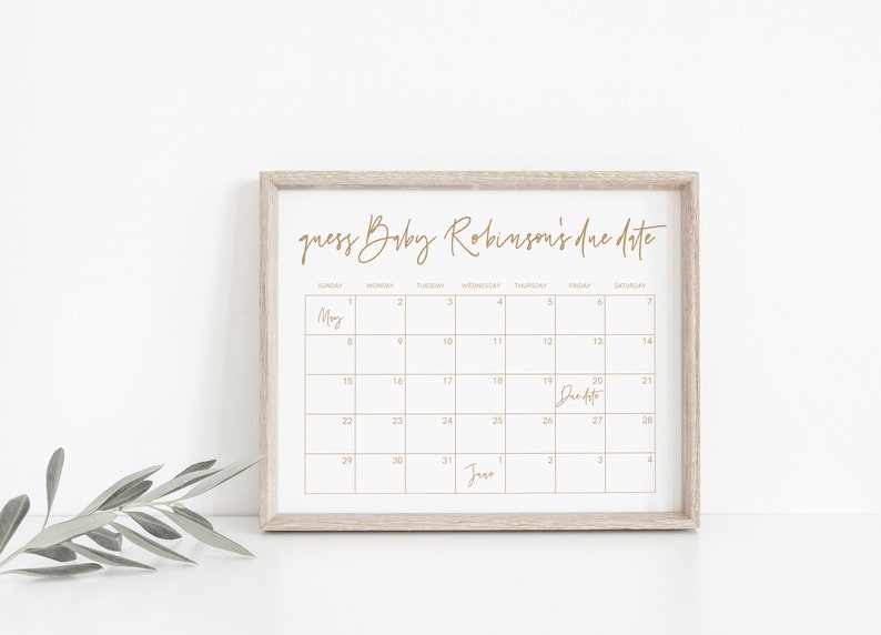 Op de afbeelding: Een afdrukbare kalender met een gouden frame, met een kalender voor de maand mei met de tekst "guess Baby Robinson's due date" bovenaan. De uitgerekende datum is op de kalender gemarkeerd als de 20e mei.