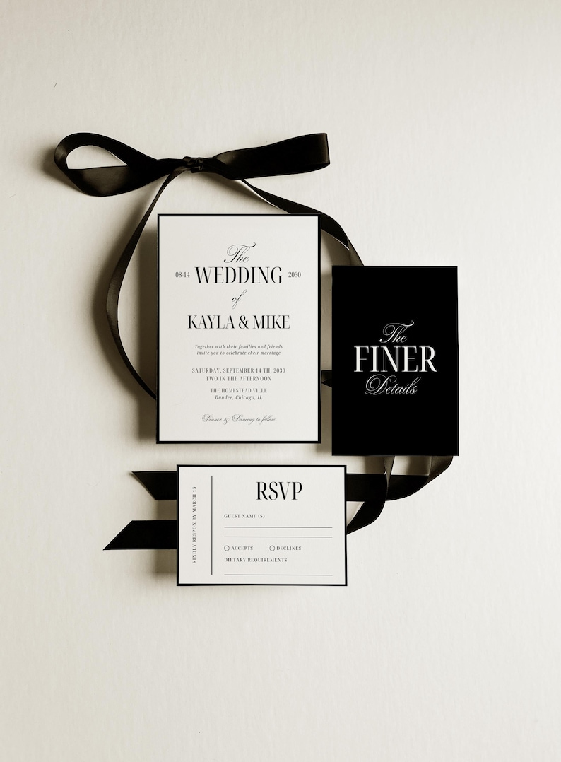 May include: Elegant wedding invitation suite with black and white stationery. The main invitation reads "The Wedding of Kayla & Mike" with event details. Includes RSVP and "The Finer Details" cards, all tied with a black ribbon.