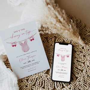 May include: A baby shower invitation with the text "She's the cherry on top" and a pink onesie illustration. The invitation is on a white card, and a smartphone displays the same design. The date is August 28th.