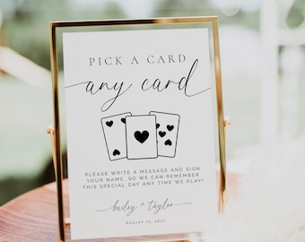 Może przedstawiać: Złota ramka z napisem "Pick a Card, any card" elegancką czcionką. Poniżej znajdują się trzy ilustracje kart do gry. Znak zawiera imiona "Bailey + Taylor" i datę "August 10, 202X".