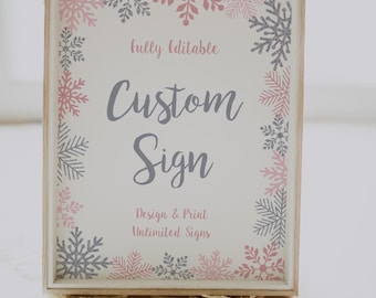 May include: A white sign with a wooden frame and a pink and gray snowflake border. The sign says "Fully Editable Custom Sign Design & Print Unlimited Signs".