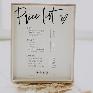 May include: A white framed sign with a black handwritten price list for hair salon services. The sign lists prices for haircuts, styling, and color services. The sign also includes social media icons and a website address.