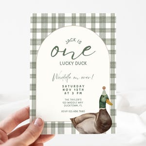 May include: A green and white checkered invitation card with a duck wearing a party hat. The text on the card reads "Jack is one Lucky Duck Waddle on over! Saturday Nov 12th at 3 PM The Taylor's 123 Waddle Way Ducktown, FL RSVP 123.456.7880"
