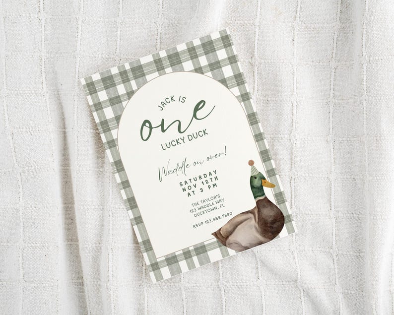 May include: A green and white gingham patterned invitation with a white arch. The text reads "Jack is one lucky duck. Waddle on over! Saturday Nov 12th at 3 PM. The Taylor's 123 Waddle Way Ducktown, FL RSVP 123.456.7880". A cartoon duck wearing a party hat is in the bottom right corner.