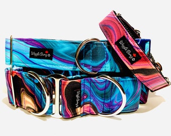 May include: Three colorful dog collars with silver hardware. The collars feature a swirling blue, purple, and pink pattern. The collars are labeled "Wiggle Buns".