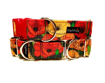 May include: A red, yellow, and black dog collar with a poppy flower print. The collar has two silver D-rings and a red plastic buckle. The collar is labeled "Wiggle Buns".