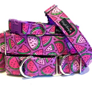 May include: Three watermelon print dog collars with purple trim and silver hardware. The top collar has the text "Wiggle Buns" on it.
