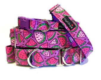 May include: Three watermelon print dog collars with purple trim and silver hardware. The top collar has the text "Wiggle Buns" on it.