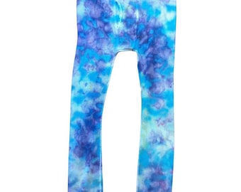 May include: Tie-dye thermal underwear in shades of blue and purple. The long johns feature a waffle knit texture and a classic design with a functional fly. The colors blend together in a unique pattern, creating a vibrant and eye-catching look.