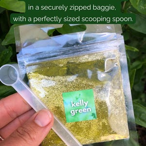 May include: A clear plastic bag filled with a green glitter-like substance. The bag has a zipper closure and a label that says "kelly green". A clear plastic spoon is included.