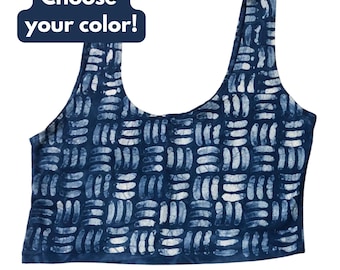 May include: A navy blue crop top with a white geometric pattern. The top has a scoop neck and wide straps. Text on the top left says "Choose your color!"