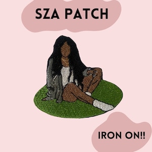 May include: Embroidered patch featuring a seated figure with long black hair, wearing a jacket and gold necklace, on a green oval. The text "SZA PATCH" is above the figure, and "IRON ON!!" is below. The background is light pink.