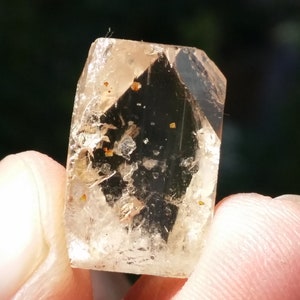 Topaz Crystal with Double Terminations and Rare Triplite Inclusions