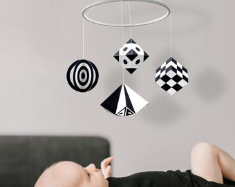 Montessori baby mobile. Black and white hanging toy for newborn