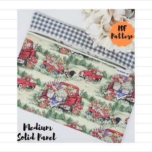 May include: A PDF pattern for a medium-sized zippered pouch with a red truck and flower print. The pouch is lined with a black and white gingham fabric. The text "The Bobbin Jar" is visible on the pouch.