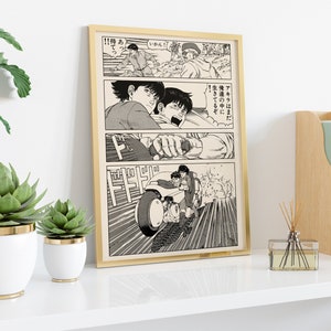 May include: A black and white manga print featuring a scene of two characters riding a motorcycle. The text in the image reads "!!待あ" and "いかん!" and "アキラはまだ" and "俺達の中に" and "生きてるぞ".