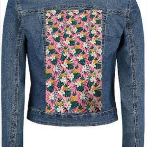 May include: A blue denim jacket with a colourful back panel. The panel displays a tropical pattern of pineapples, white flowers, and green leaves. The jacket has a classic collar and buttoned cuffs.