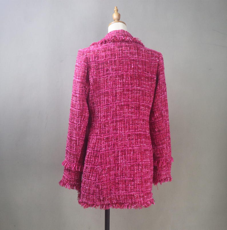 Back view of the handmade hot pink tweed blazer highlighting its structured fit, clean seam lines, and raw-edge fringe hem.