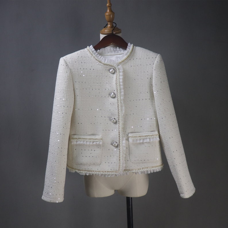 Front view of custom white sequin jacket with pearl and chain trim – elegant women’s formal jacket for weddings, graduations, and evening events